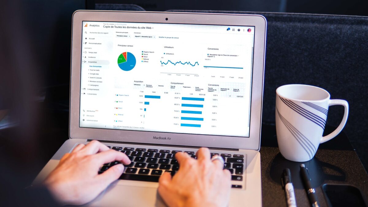 Person viewing website traffic charts on a laptop